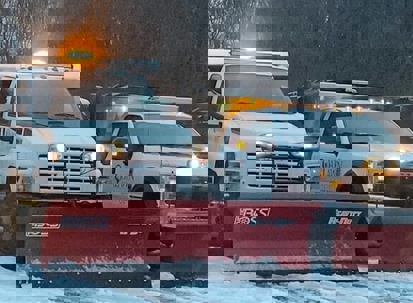 Two Oaklawn Landscaping trucks are ready for winter