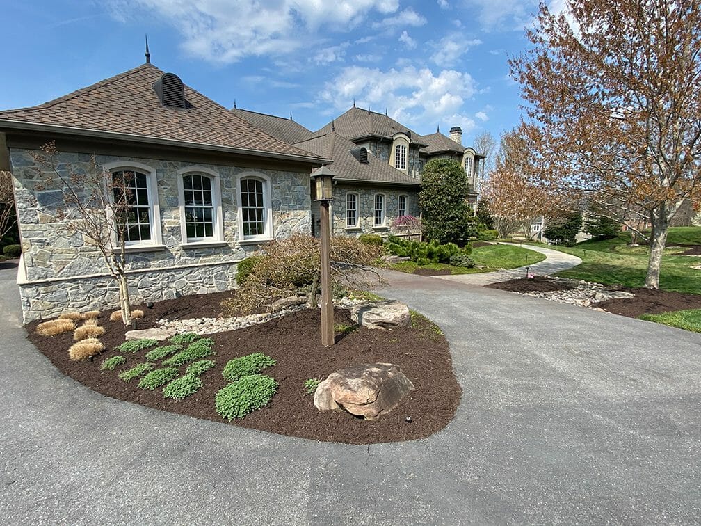 Exterior shot of a luxury home and driveway. 