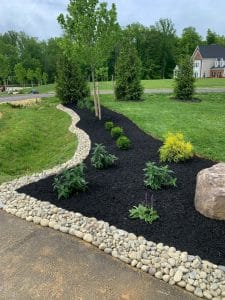 This image shows a lovely landscaped garden bed for your home. 