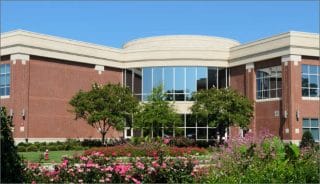 The building boasts meticulously maintained landscaping.